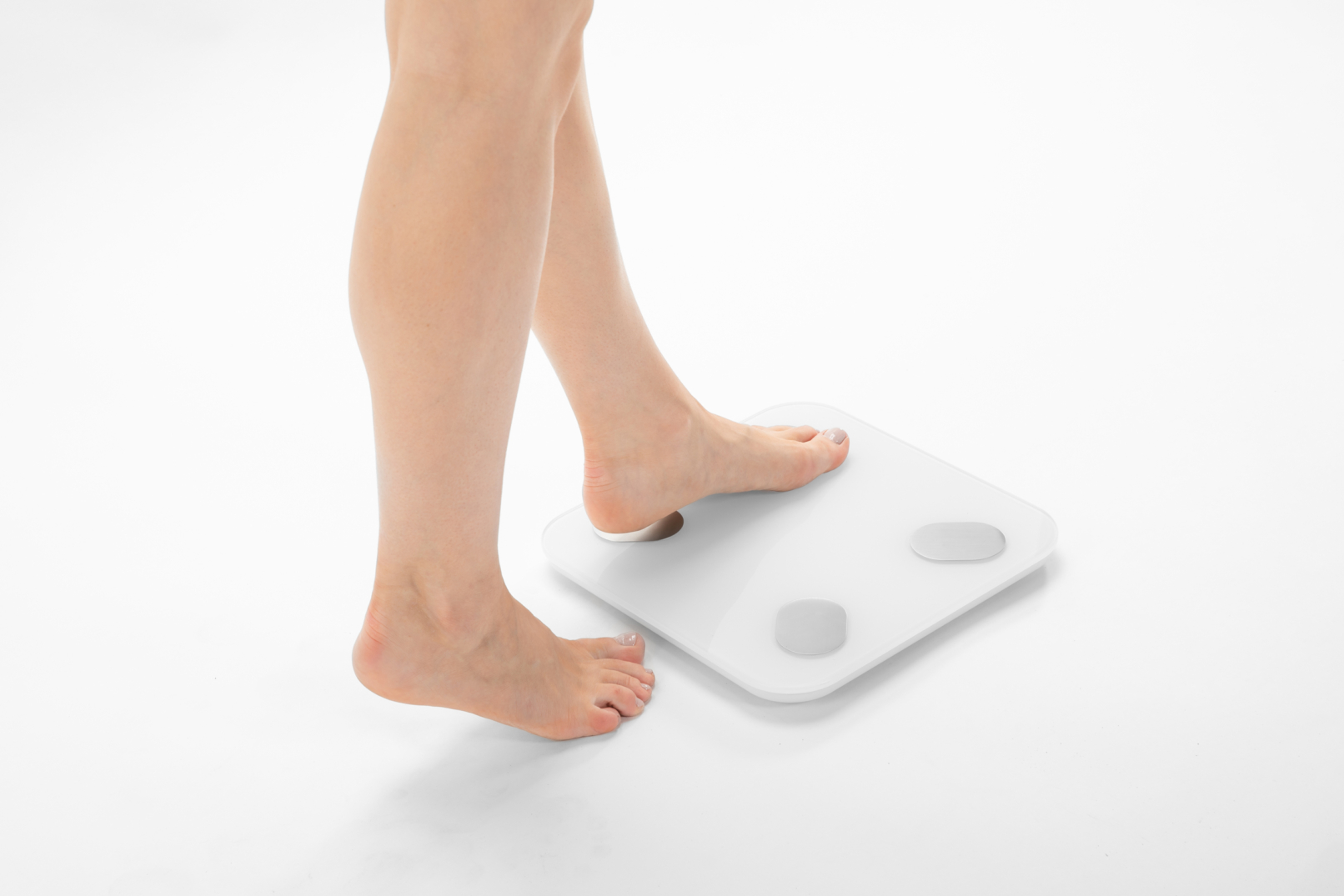 Young woman with bare legs stepping onto the PDS-200C Personal Digital Scale